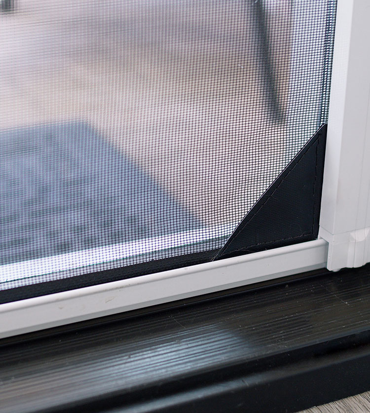 A home door screen reinforced with mesh lock for stability and durability and to keep small pets in.